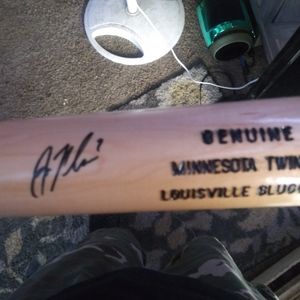 Baseball bat signed by joe mauer